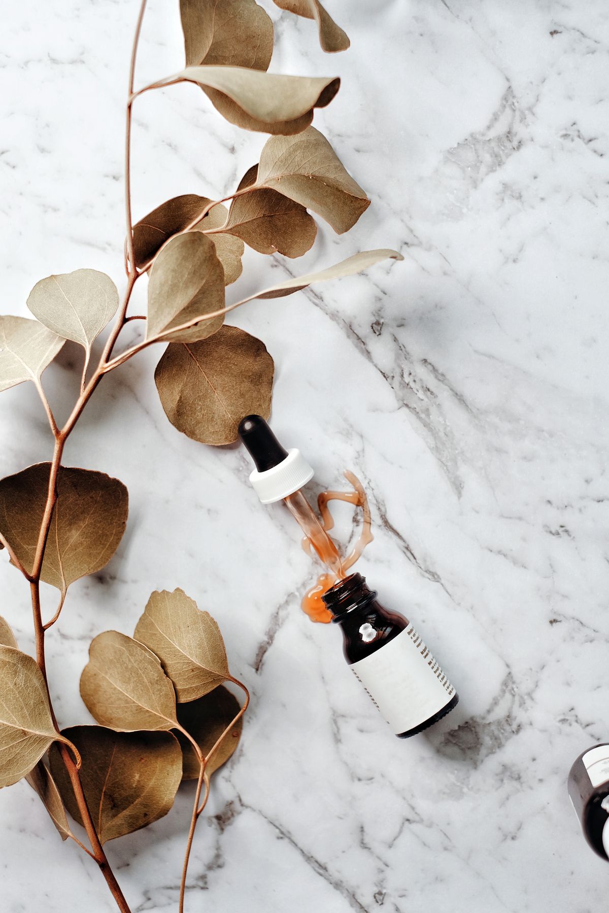 French pharmacy skincare products arranged in a flatlay - the best of the parapharmacie